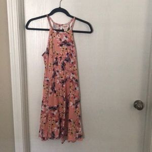 High neck, flares at the navel